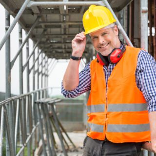 Portrait,Of,Confident,Bricklayer,At,Construction,Site