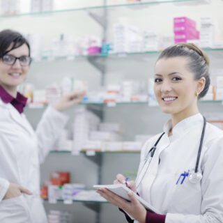 Team,Of,Pharmacist,Chemist,Woman,Group,Standing,In,Pharmacy,Drugstore