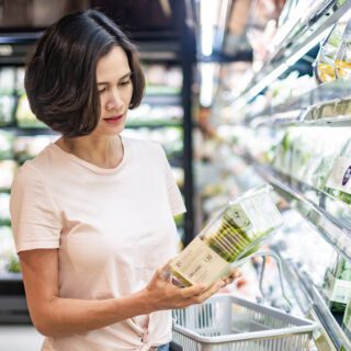 Young,Asian,Beautiful,Woman,Holding,Grocery,Basket,Walking,In,Supermarket.